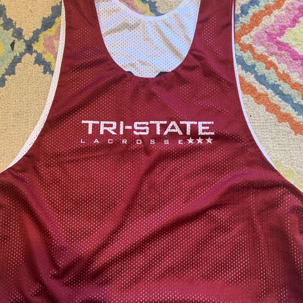 Reversible tri-state lacrosse pennie